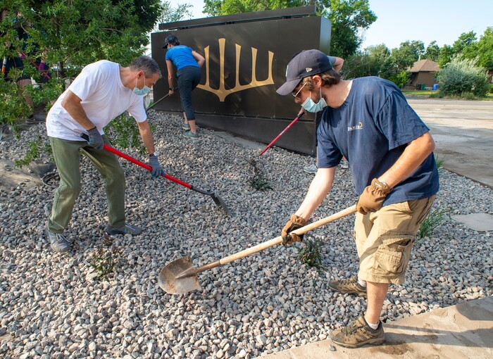 (Rick Egan  |  The Salt Lake Tribune)      Chris Juchau, Stake President of the Church of Jesus Christ of Latter Day Saints Highland Utah South Stake left, spreads rocks with Rabbi Sam Spector of Congregation Kol Ami, right, as Juchau and members of his stake help xeriscape the grounds around the building on Wednesday, Aug. 5, 2020.