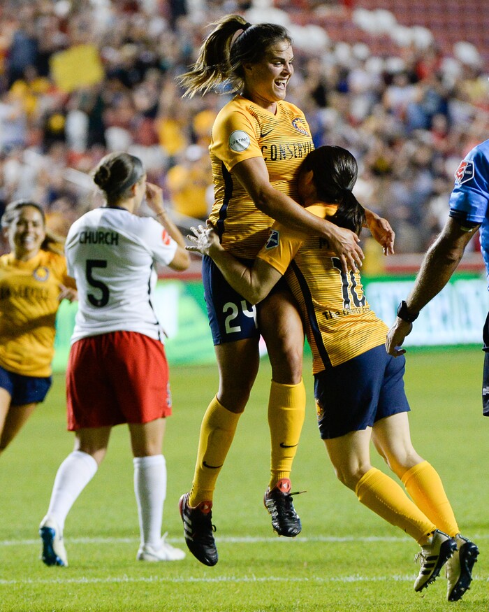 (Francisco Kjolseth  |  The Salt Lake Tribune)  Utah Royals FC hosts Washington Spirit, NWSL soccer at Rio Tinto Stadium in Sandy, Wed. Aug. 8, 2018. Utah Royals FC forward Katie Stengel (24) is celebrated by teammates after scoring the winning goal over Washington Spirit for a final 1-0 score. 