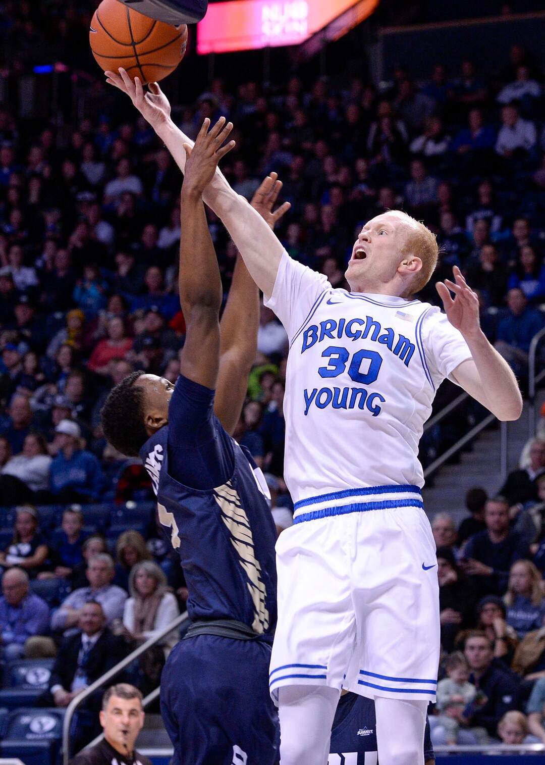 (Leah Hogsten  |  The Salt Lake Tribune) Brigham Young Cougars guard TJ Haws (30) battles Oral Roberts Golden Eagles guard Deondre Burns (2) at the net as Brigham Young University hosts Oral Roberts, Dec. 28, 2019 at the Marriott Center in Provo.