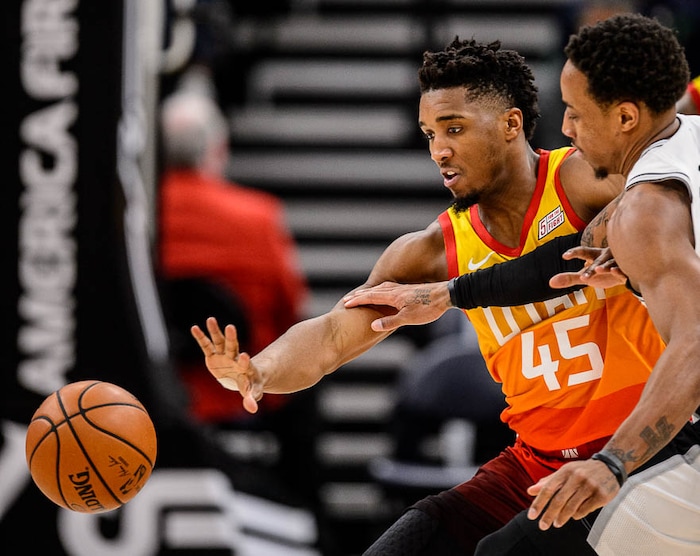 (Trent Nelson | The Salt Lake Tribune)  
Utah Jazz guard Donovan Mitchell (45) chases down the ball ahead of San Antonio Spurs guard DeMar DeRozan (10) as the Utah Jazz host the San Antonio Spurs, NBA basketball in Salt Lake City on Saturday Feb. 9, 2019.