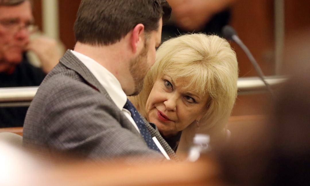 Salt Lake County Clerk Sherrie Swensen speaks with Deputy Salt Lake County District Attorney Adam Miller during arguments in Third District Court Thursday Nov. 15, 2018, in West Jordan, Utah. A Utah judge has reserved a decision on a lawsuit in a tight House race filed by a Republican incumbent who is seeking to halt vote counting in a Democratic-leaning county that's key to the outcome. Judge James Gardner heard arguments Thursday in the lawsuit filed by U.S. Rep Mia Love, but ended the hearing without making a ruling. (AP Photo/Rick Bowmer, Pool)