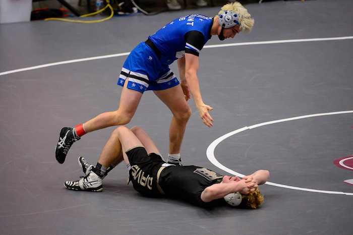 (Trent Nelson | The Salt Lake Tribune)  Pleasant Grove's Anthony Ridge holds a hand out to Davis's Zackary Edgmon, 6A State Championships, high school wrestling quarterfinals in Orem, Wednesday February 7, 2018.
