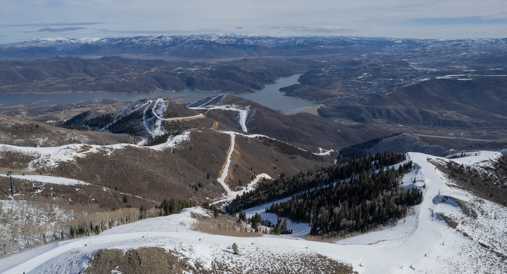 (Francisco Kjolseth | The Salt Lake Tribune) Little snow covers the mountain above the Deer Valley East Village on Tuesday, Feb. 3, 2026. A pair of winter storms are expected to drop powder on Utah's ski resorts this week.