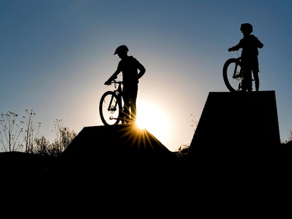 (Francisco Kjolseth | The Salt Lake Tribune) Sam Anderson, 13, and his brother Jacob, 11, assess the “big drops” at a new mountain bike park taking shape at Lodestone Regional Park in Kearns on Thursday, Jan. 30, 2025. The park is one of many that could receive upgrades if Salt Lake County's recreation bond passes.