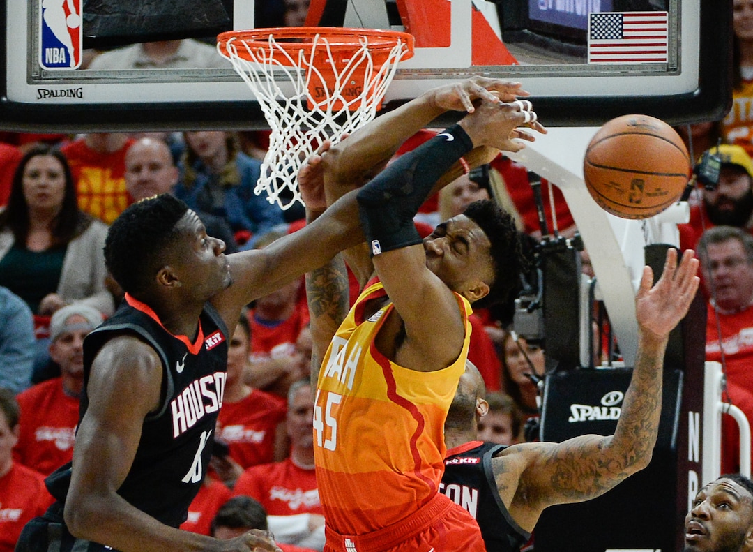 (Francisco Kjolseth  |  The Salt Lake Tribune)  Utah Jazz guard Donovan Mitchell (45) battles the Rockets for a rebound in Game 3 of a first-round NBA basketball playoff series in Salt Lake City, Saturday, April 20, 2019.
