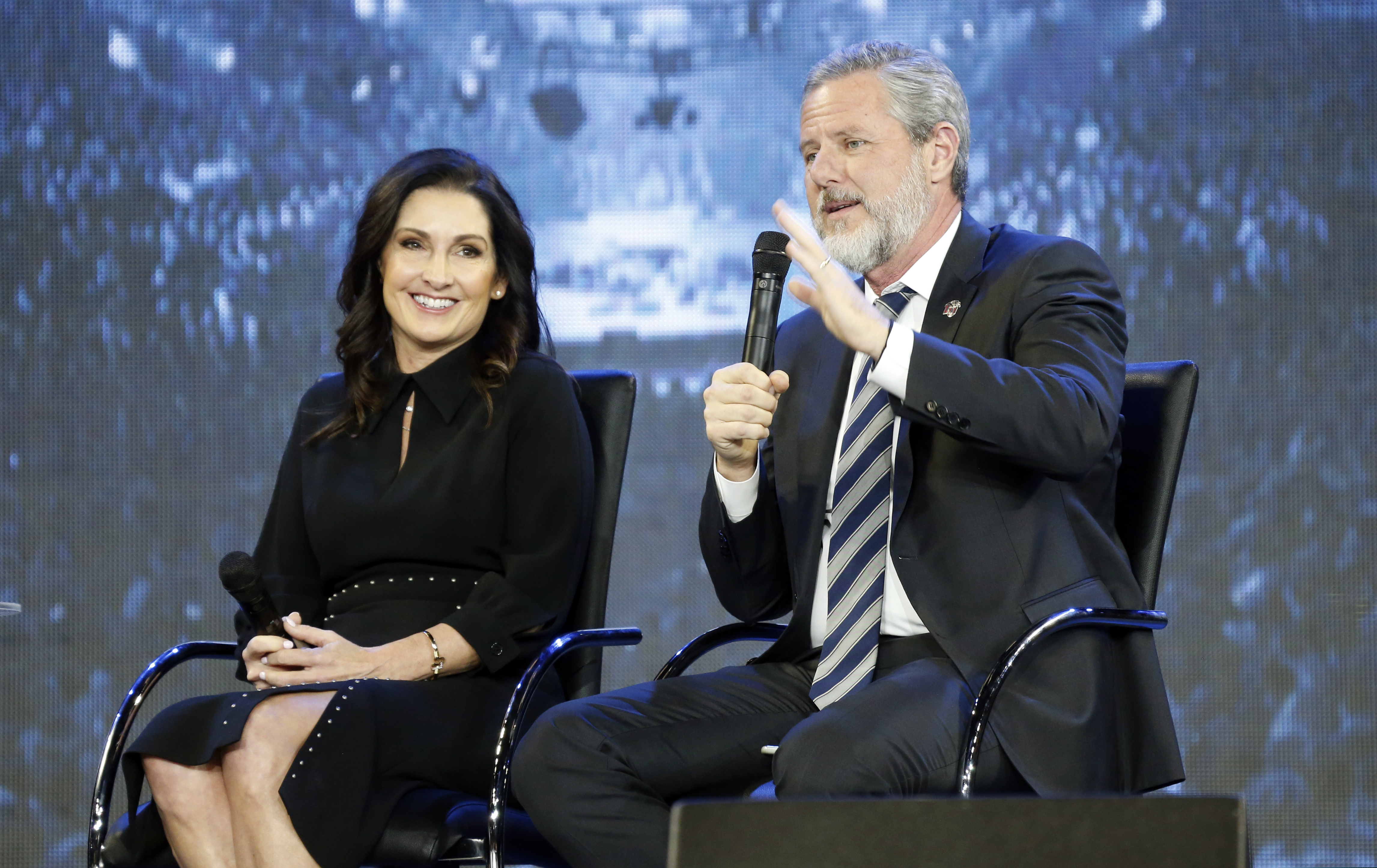 (Steve Helber | AP file photo)  Rev. Jerry Falwell Jr., right, and his wife Becki during after a town hall at a convocation at Liberty University in Lynchburg, Va., on Nov. 28, 2018.