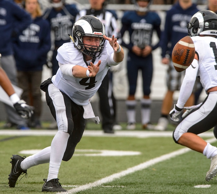 (Steve Griffin  |  The Salt Lake Tribune)  Highland quarterback Cole Peterson pitches the ball outside during the Class 5A state quarterfinal football game against Corner Canyon at Corner Canyon in Draper Friday November 3, 2017.