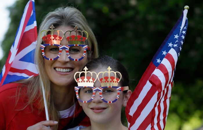 Royal fans pose for a photo prior to the wedding ceremony of Prince Harry and Meghan Markle at St. George's Chapel in Windsor Castle in Windsor, near London, England, Saturday, May 19, 2018. (AP Photo/Kirsty Wigglesworth)