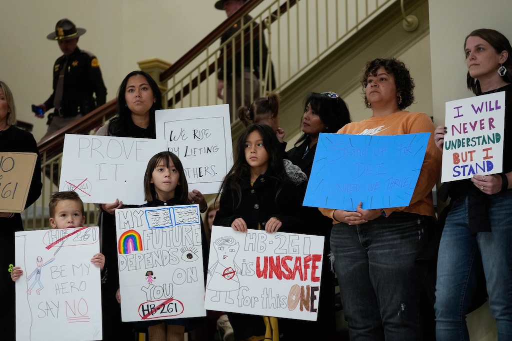 (Francisco Kjolseth | The Salt Lake Tribune) People hold a silent rally at the Utah Capitol before the Senate Education Committee hears HB261, the anti-DEI bill that would dismantle diversity offices in Utah public education and government, on Monday, Jan. 22, 2024. The Utah State Board of Education has now incorporated language from the bill into an administrative rule that was previously focused on equity.