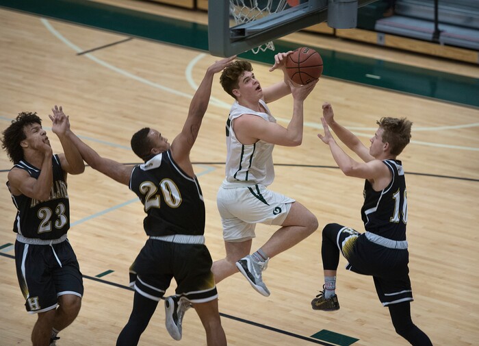 (Scott Sommerdorf | The Salt Lake Tribune)
Jeremy Dowdell splits the Highland defense to score during first half play as Olympus defeated Highland 70-49, Friday, January 19, 2018.