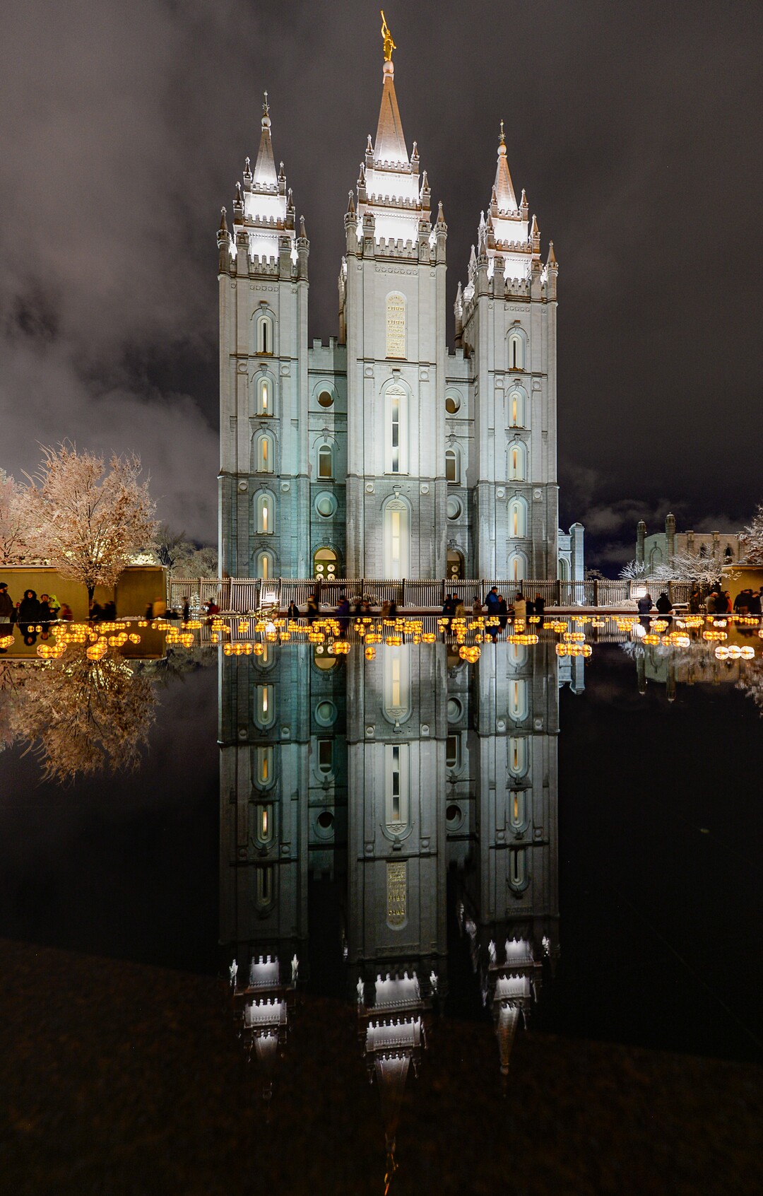 (Francisco Kjolseth  |  The Salt Lake Tribune)  Visitors take in the sights as Temple Square in Salt Lake City comes to life Friday, November 29, 2019, as hundreds of thousands of colorful LED bulbs light up, a yearly tradition that started in 1965. The lights will run through the end of the year.