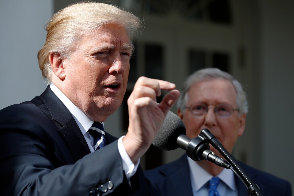 President Donald Trump answers questions as he speaks with Senate Majority Leader Mitch McConnell of Ky., in the Rose Garden after their meeting at the White House, Monday, Oct. 16, 2017, in Washington. (AP Photo/Alex Brandon)