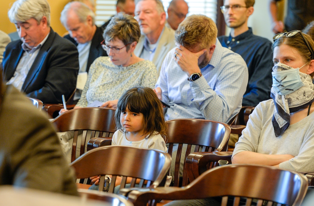 (Leah Hogsten  |  The Salt Lake Tribune)  Annabelle Marron listens as her mother Heather June Marron speaks to board members during the Utah Inland Port Authority Board meeting at the Capitol, June 5, 2019. The Inland Port Authority Board had to cancel its meeting last month after a group of protesters took over the meeting.