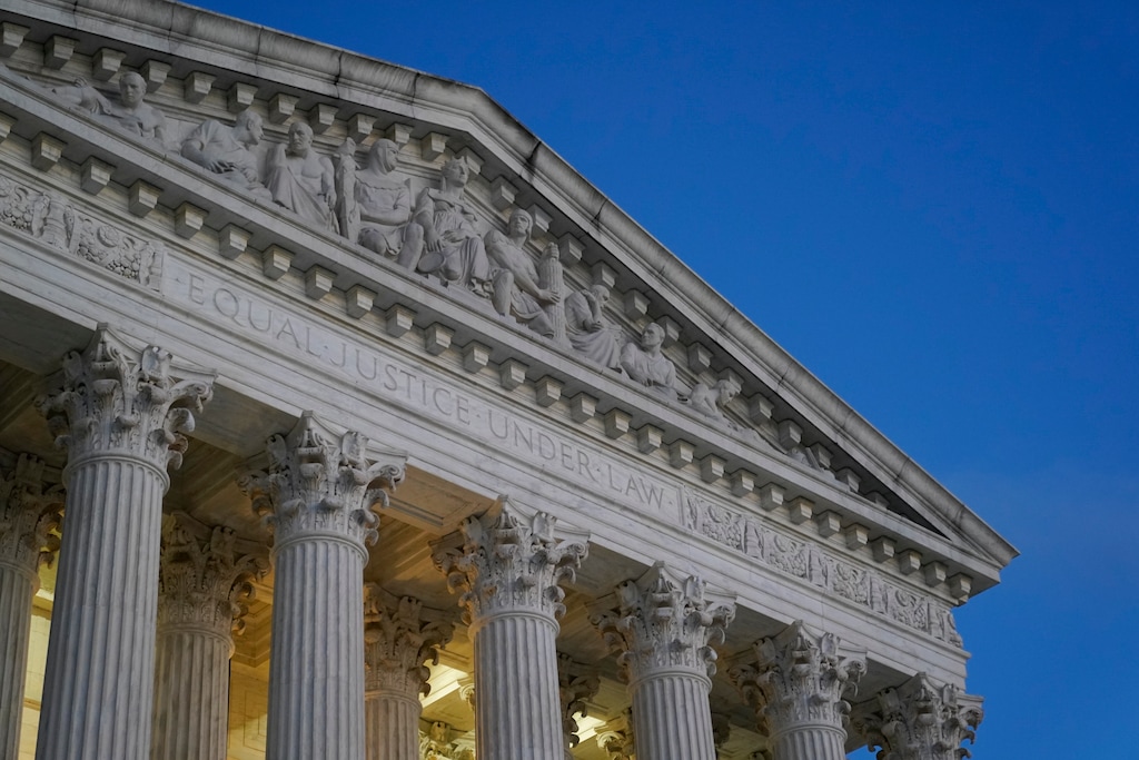 (Patrick Semansky | The Associated Press) Light illuminates part of the Supreme Court building at dusk on Capitol Hill in Washington, Wednesday, Nov. 16, 2022.