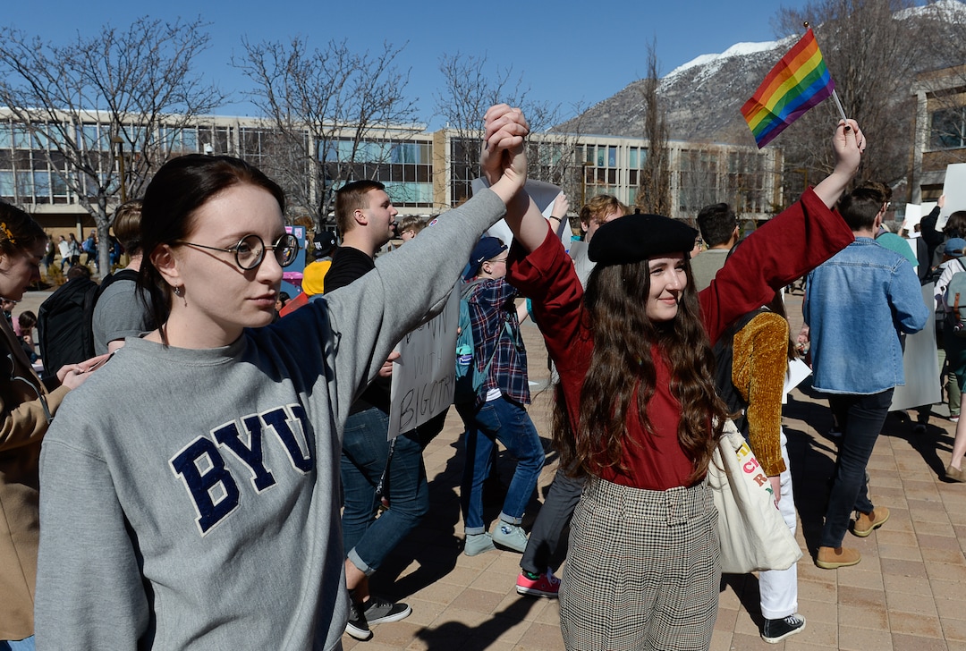 (Francisco Kjolseth  |  The Salt Lake Tribune) Friends Julia Stark, left, and Sophie Gordon join other students protesting outside the student center at Brigham Young University in Provo, Wednesday, March 4, 2020, after an official with The Church of Jesus Christ of Latter-day Saints issued a clarification to the school's Honor Code, which said that same-sex romantic behavior is still "not compatible" with the rules at BYU.