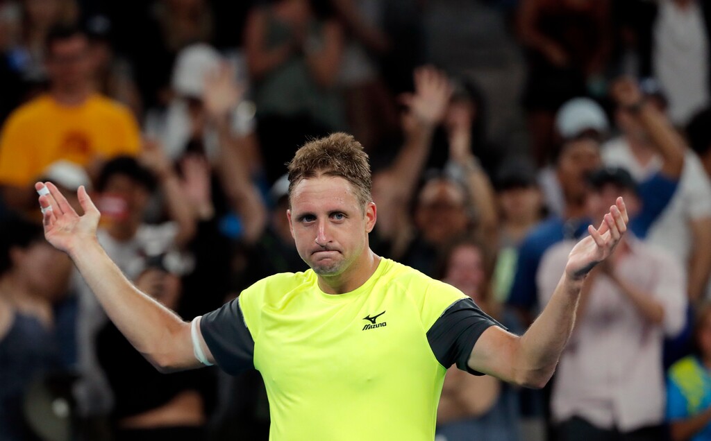 United States' Tennys Sandgren celebrates after defeating Austria's Dominic Thiem in their fourth round match at the Australian Open tennis championships in Melbourne, Australia, Monday, Jan. 22, 2018. (AP Photo/Vincent Thian)