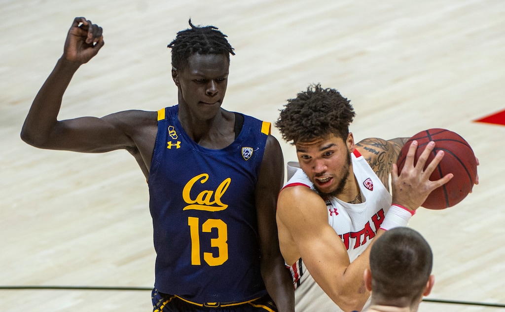 (Rick Egan | The Salt Lake Tribune) Utah Utes forward Timmy Allen (1) takes the ball to the basket as California Golden Bears forward Kuany Kuany (13) defends, in PAC12 Basketball action between the the Utah Utes and the California Golden Bears, on Wednesday, Jan. 16, 2021. According to a Twitter post on March 26, 2021, Allen will enter the NCAA Transfer Portal.