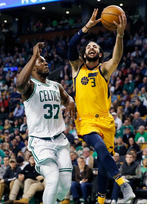 Utah Jazz's Ricky Rubio (3) goes up to shoot against Boston Celtics' Semi Ojeleye (37) during the first quarter of an NBA basketball game in Boston, Friday, Dec. 15, 2017. (AP Photo/Michael Dwyer)