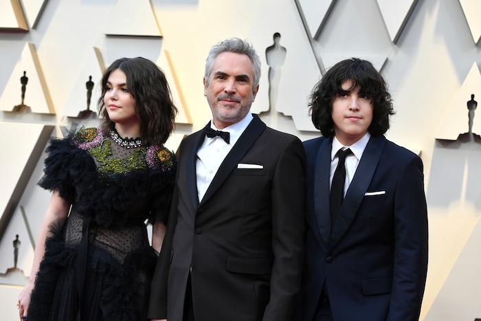Tess Bu Cuaron, from left, Alfonso Cuaron, and Olmo Teodoro Cuaron arrive at the Oscars on Sunday, Feb. 24, 2019, at the Dolby Theatre in Los Angeles. (Photo by Jordan Strauss/Invision/AP)