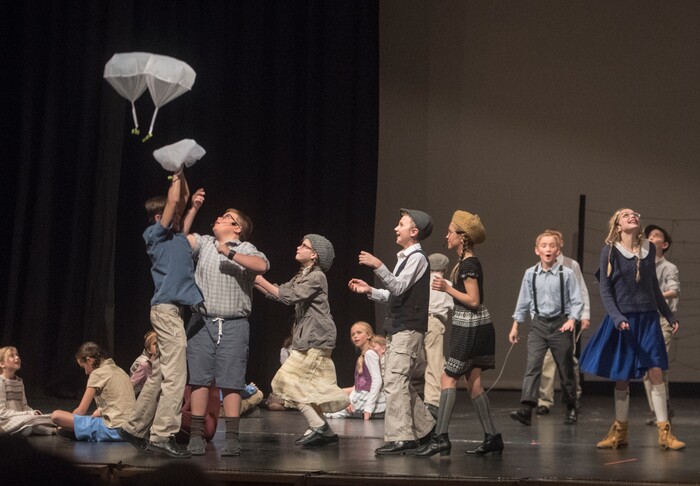 (Rick Egan | The Salt Lake Tribune) Mueller Park Jr High students playing children from West Berlin, chase handkerchiefs with candy bars attached in the Mueller Park Jr High production of "The Berlin Candy Bomber" at Woods Cross High School, Saturday, November 11, 2017.