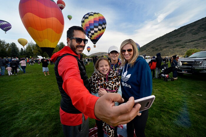 (Scott Sommerdorf | The Salt Lake Tribune)
The Garcia family takes a selfie as balloons launch at the 4th annual Autumn Aloft Hot Air Balloon Festival in Park City, Sunday, September 17, 2017.