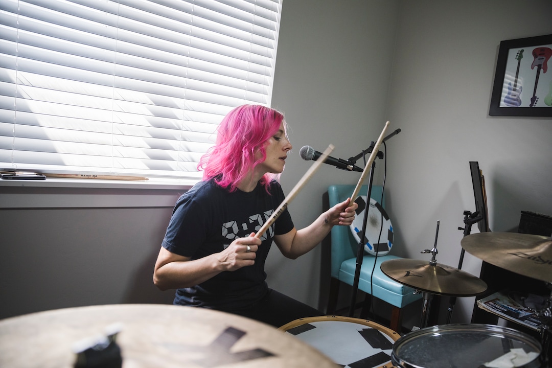 (Clark Clifford  |  For The Salt Lake Tribune) Elaine Bradley of Noble Bodies drumming during a practice for an upcoming show in the band's rehearsal space in Orem on Saturday, Aug. 3, 2019.