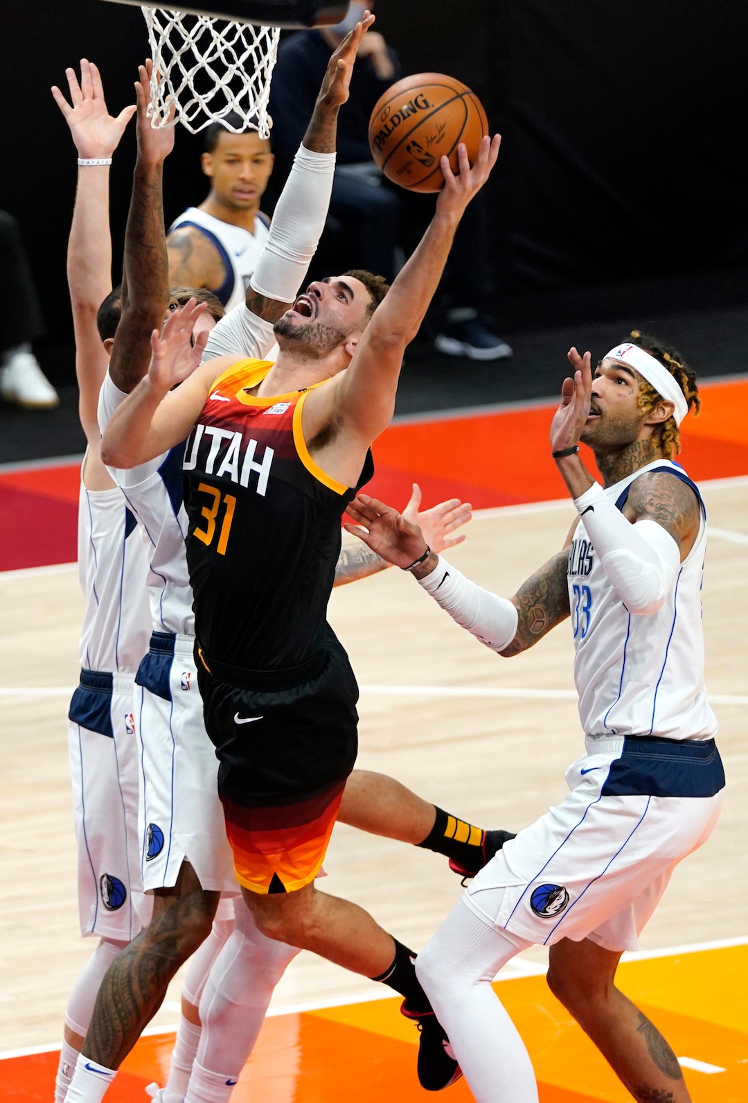 (Rick Egan | The Salt Lake Tribune)  Utah Jazz forward Georges Niang (31) goes up for a shot as Dallas Mavericks forward James Johnson (16) defends, in NBA action between the Utah Jazz and the Dallas Mavericks at Vivint Arena, on Friday, Jan. 29, 2021.