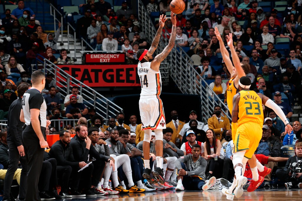 In a photo provided by the New Orleans Pelicans,New Orleans Pelicans forward Brandon Ingram (14) shoots against Utah Jazz forward Bojan Bogdanovic (44) during an NBA basketball game Friday, March 4, 2022, in New Orleans. (Layne Murdoch Jr./New Orleans Pelicans via AP)