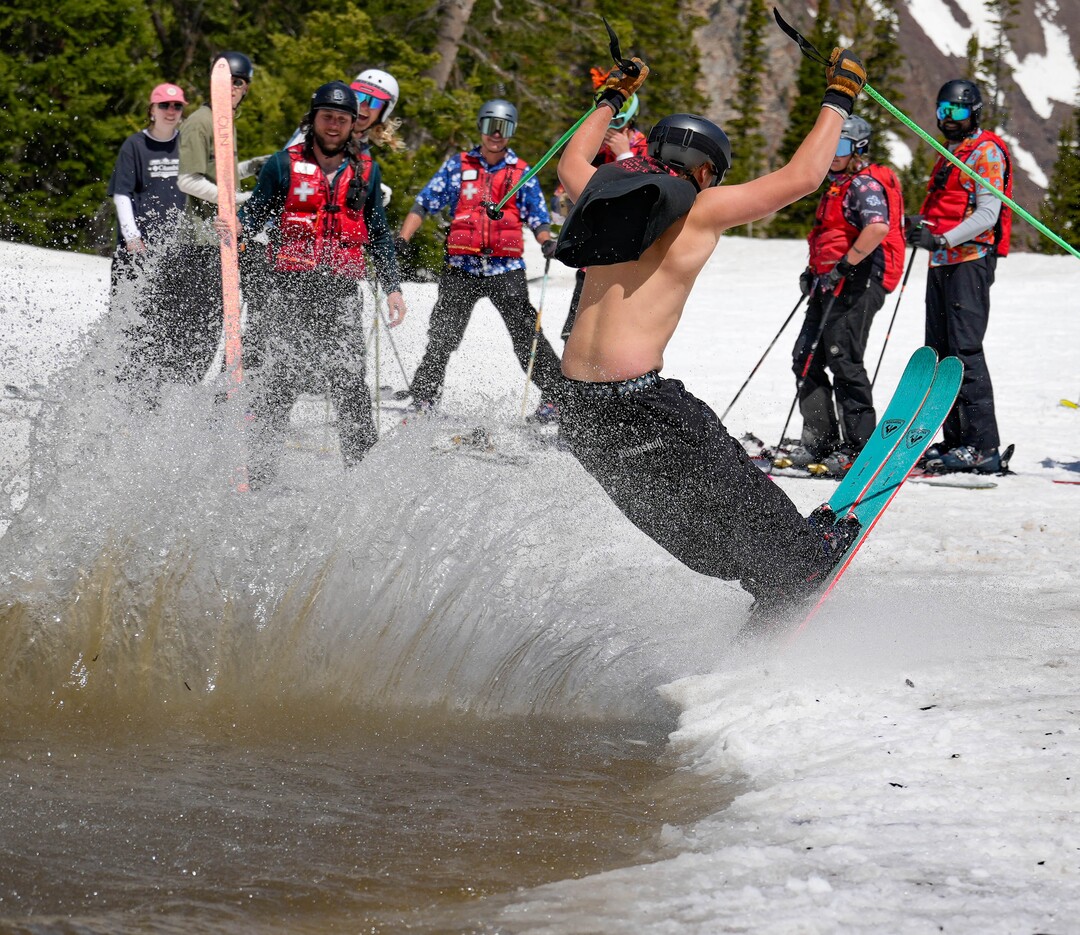 (Francisco Kjolseth  | The Salt Lake Tribune) A party atmosphere forms at the pond in Peruvian Gulch as Snowbird closes the book on the 2024-25 ski season on Monday, May 26, 2025. Snow and sun revelers took to the slushy slopes on Memorial Day as the resort was the last in the state to close.