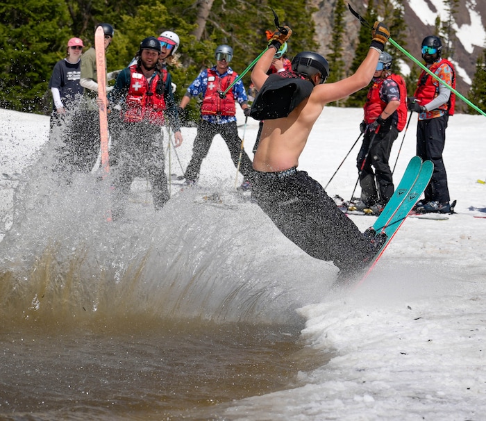 (Francisco Kjolseth  | The Salt Lake Tribune) A party atmosphere forms at the pond in Peruvian Gulch as Snowbird closes the book on the 2024-25 ski season on Monday, May 26, 2025. Snow and sun revelers took to the slushy slopes on Memorial Day as the resort was the last in the state to close.