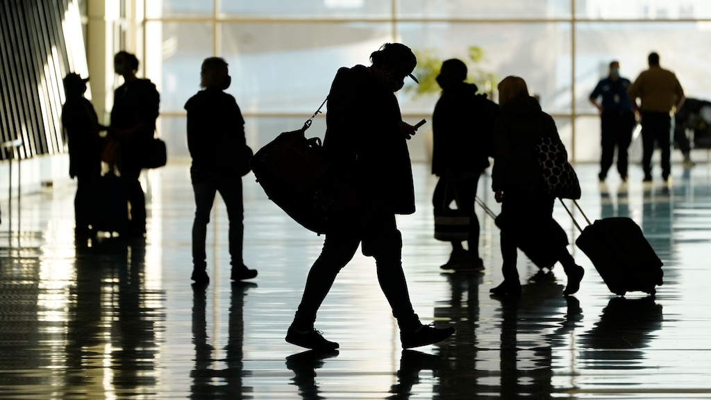 (Rick Bowmer | AP file photo) In this Oct. 27, 2020, file photo, passengers walk through Salt Lake City International Airport, in Salt Lake City. Some 13,000 passengers were expected at the airport on Wednesday, up from an average 10,000 during the pandemic.