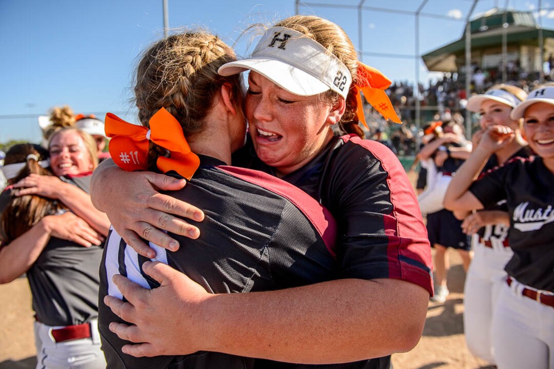 (Trent Nelson | The Salt Lake Tribune)Herriman players celebrate a win over Syracuse in the 6A Softball State Championship game, Thursday May 24, 2018. Herriman's Kaitlyn Slade (10) and Herriman's Lexi Slade (22) embrace.