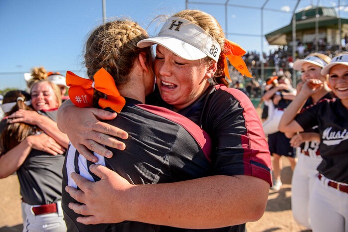 (Trent Nelson | The Salt Lake Tribune)
Herriman players celebrate a win over Syracuse in the 6A Softball State Championship game, Thursday May 24, 2018. Herriman's Kaitlyn Slade (10) and Herriman's Lexi Slade (22) embrace.