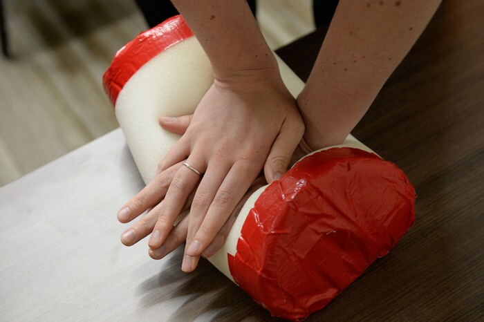 (Francisco Kjolseth | The Salt Lake Tribune) Sara Tanner applies direct pressure in a simulation during the 'Stop the Bleed' campaign which drew people to Utah Valley Hospital in Provo on Tuesday, June 5, 2018, for a free class to learn the basic actions to stop life threatening bleeding following everyday emergencies, mass shootings or natural disasters.