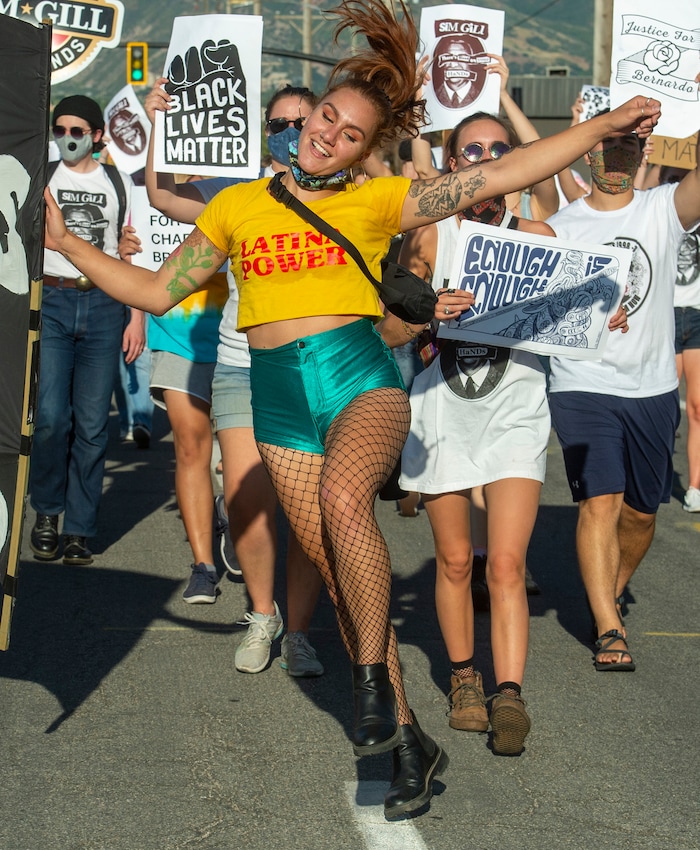 (Rick Egan  |  The Salt Lake Tribune)    Natalie
Montangue dances in the street, during the Dance Dance Revolution protest for racial equality, on Sunday, Aug. 9, 2020.