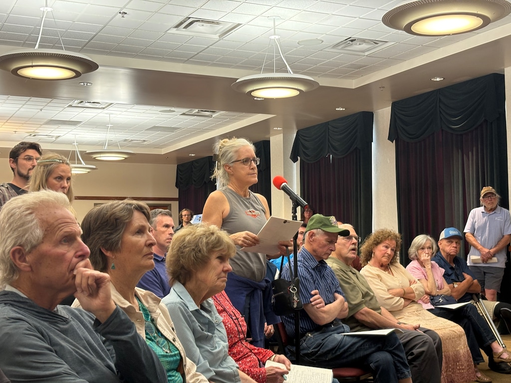 (Brooke Larsen | The Salt Lake Tribune) A resident raises concerns and questions about the proposed Red Butte energy campus and data center in Iron County during an open house in Cedar City on Thursday, May 14, 2026.