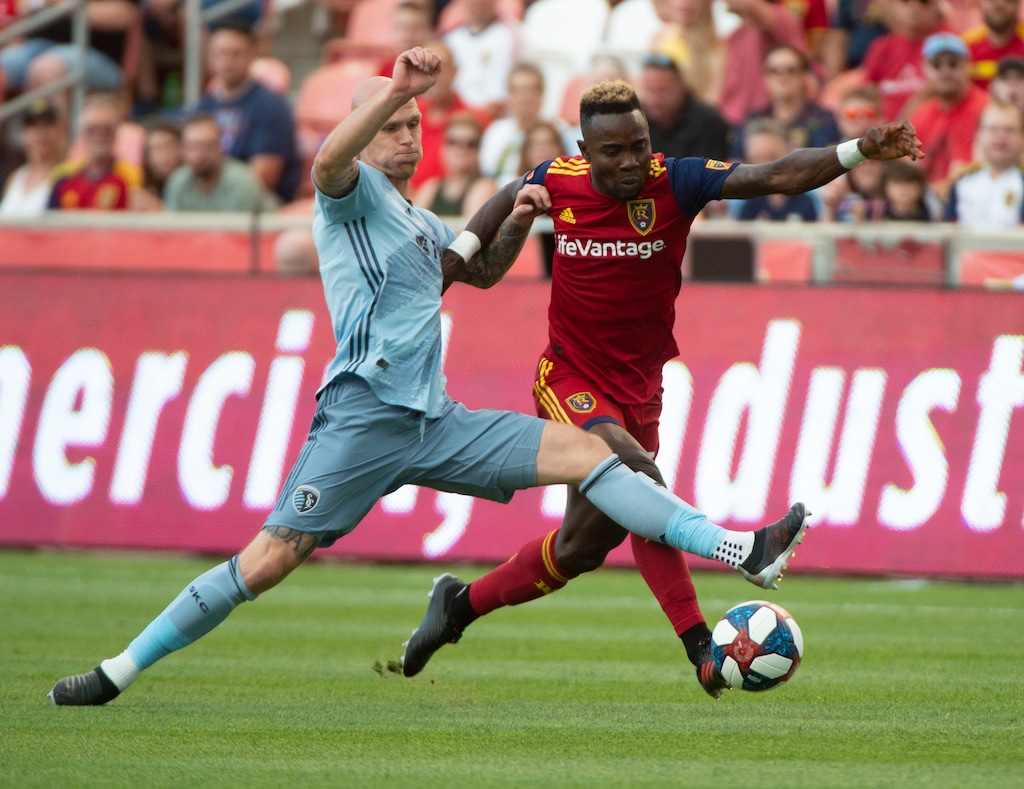(Rick Egan  |  The Salt Lake Tribune)  Sporting Kansas City defender Botond Barath (2) goes for the ball along with Real Salt Lake forward Sam Johnson (50), in MLS soccer ction between Real Salt Lake and Sporting Kansas City, in Sandy, Saturday, June 29, 2019.