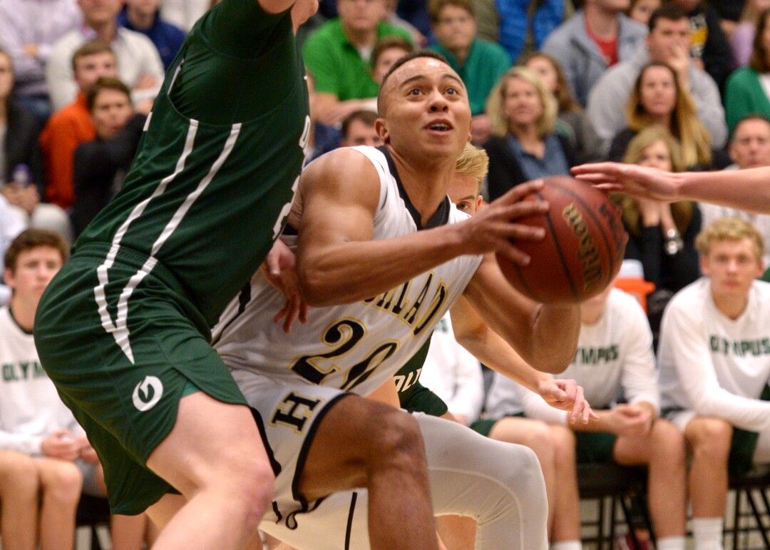 (Leah Hogsten  |  The Salt Lake Tribune) Highland's Elijah Shelton looks for the shot. Olympus High School defeated Highland High School 86-54 during their basketball game, Tuesday, February 6, 2018.