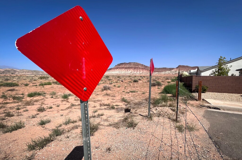 (David Condos | KUER ) Even with Washington County’s rapid growth, there are places where the sprawl stops. Here, a neighborhood road dead ends in an open desert controlled by the Bureau of Land Management, Sept. 13, 2024.