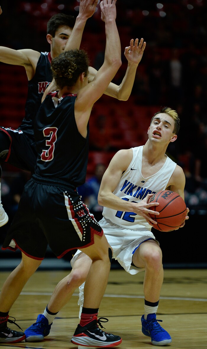 (Francisco Kjolseth  |  The Salt Lake Tribune)  Weber vs Pleasant Grove, 6A State high school basketball tournament at the Huntsman Center in Salt Lake City, Thursday March 1, 2018. Pleasant Grove's Tyler Fairbanks (12) hits the Weber defense. 
