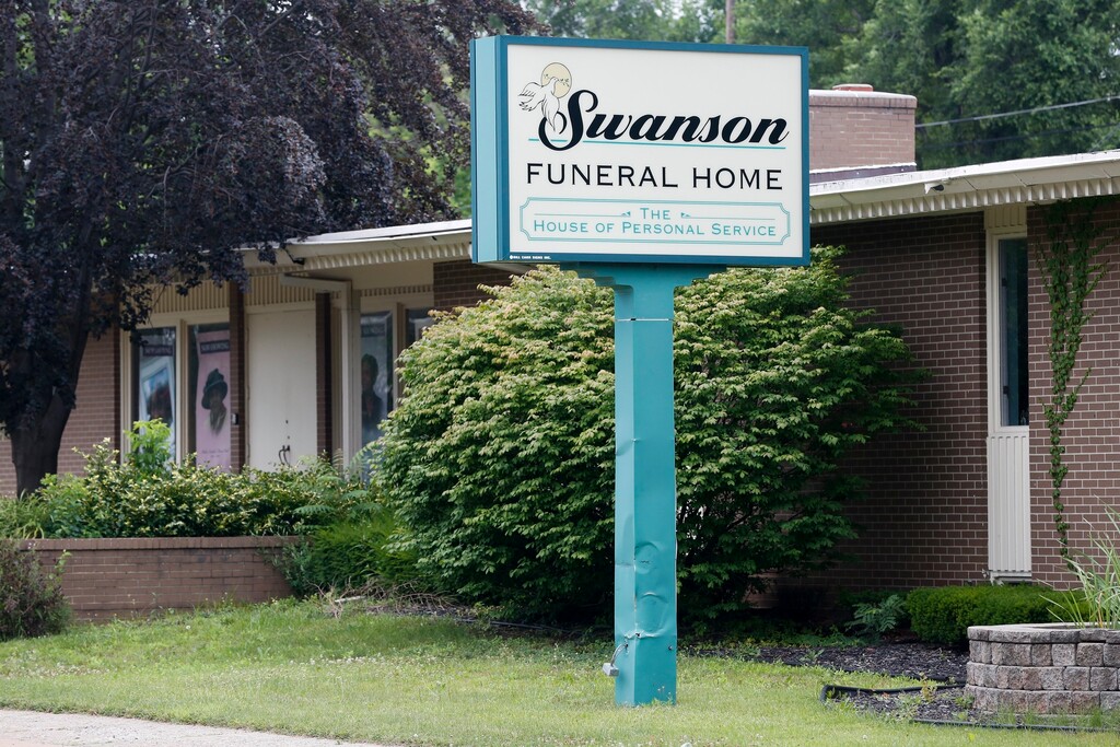 (Terray Sylvester | The Flint Journal-MLive.com via AP) In a July 12, 2017 file photo, the Swanson Funeral Home is seen on Martin Luther King Avenue in Flint, Mich. The state has shut down the funeral home, saying maggots were in a garage where unrefrigerated bodies were being stored.