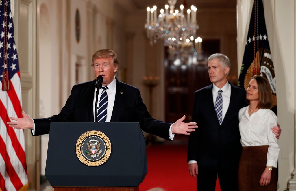 President Donald Trump speaks in the East Room of the White House in Washington, Tuesday, Jan. 31, 2017, to announce Judge Neil Gorsuch as his nominee for the Supreme Court. Gorsuch stands with his wife Louise. (AP Photo/Carolyn Kaster)