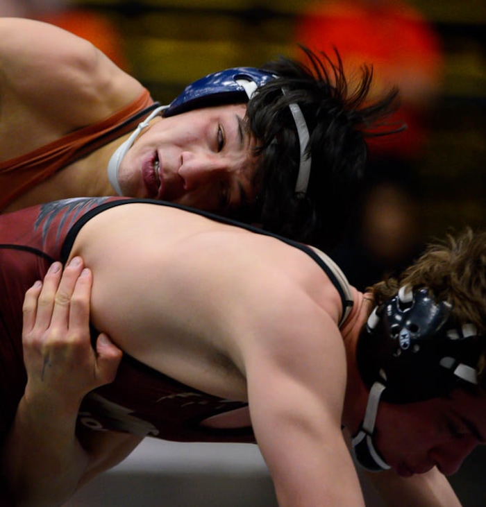 (Trent Nelson | The Salt Lake Tribune)  Brighton's Anthonee Ouk (top) and Maple Mountain's Cole Tierre Patterson, 5A State Championships, high school wrestling quarterfinals in Orem, Wednesday February 7, 2018.