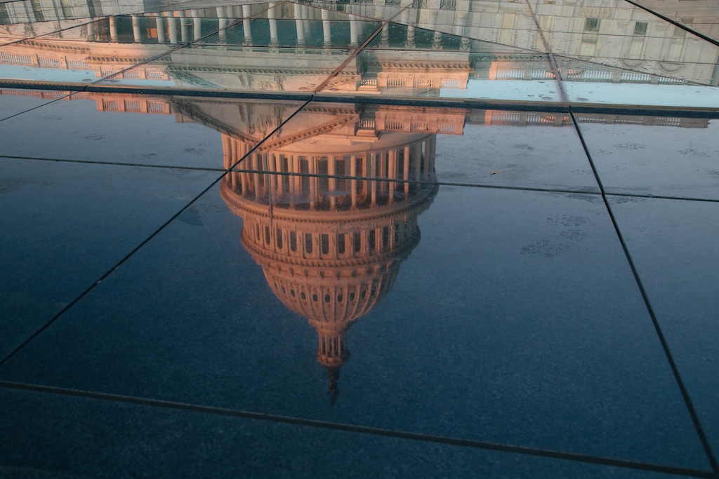 (Alyssa Schukar | The New York Times) A reflection of the sun rising on the Capitol in Washington, Dec. 18, 2019. Most people are paying attention, get what it’s all about and have strong opinions about impeachment — but not always the opinions you’d expect.