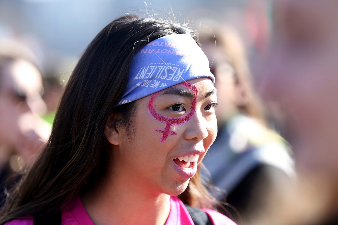 Gavi Kamens, 16, of Bryn Mawr, Pa., painted her face as thousands gather for the Women's March in Philadelphia on Saturday, Jan.  20, 2018. The march is among dozens of rallies being held around the country. The activists are hoping to create an enduring political movement that will elect more women to government office. (David Maialetti /The Philadelphia Inquirer via AP)