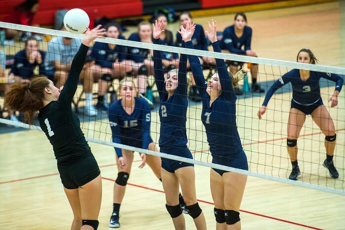 (Chris Detrick | The Salt Lake Tribune) Skyline's Gabby Latteier (2) and Skyline's Anna Pingree (7) go up to block West's Heleine FilipeÊ(1) during the volleyball match at West High School Tuesday, October 3, 2017.