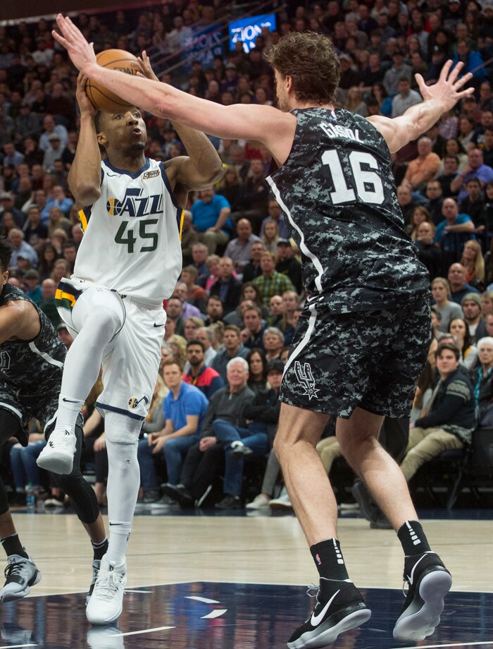 (Rick Egan  |  The Salt Lake Tribune)   Utah Jazz guard Donovan Mitchell (45) goes up for a shot against San Antonio Spurs center Pau Gasol (16), in NBA action, in Salt Lake City, Monday, February 12, 2018.
