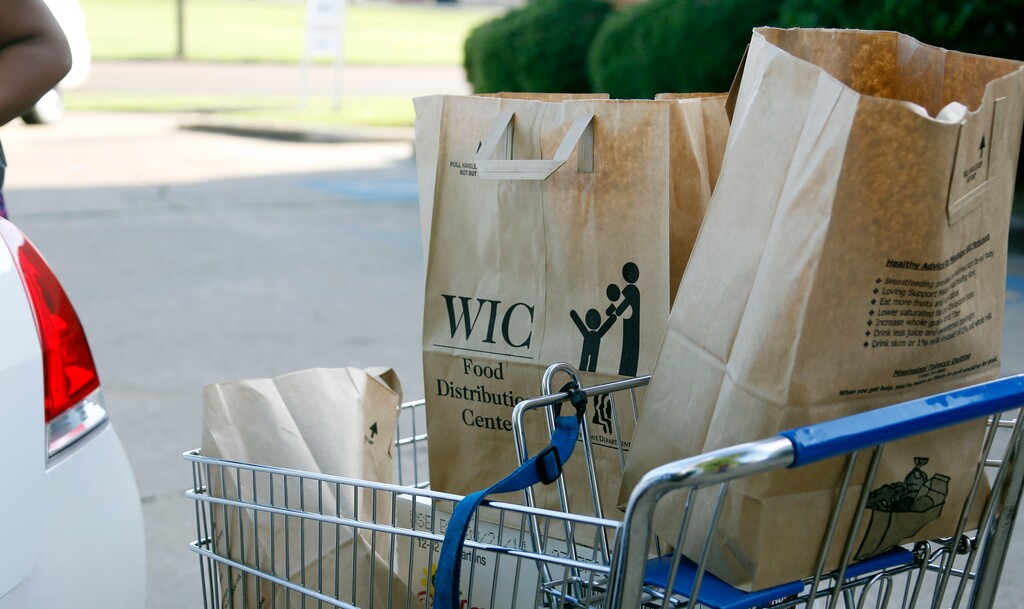(Rogelio V. Solis  |  AP file photo)  In this 2013 file photo, grocery bags loaded with food from the Special Supplemental Nutrition Program for Women, Infants and Children, better known as WIC, sit in a cart before being loaded into a vehicle in Jackson, Miss. Despite a partial shutdown of the federal government that year, Mississippi got permission to keep operating WIC through October. While Utah has decided it can weather this year's federal shutdown through January, federal funds for the Utah Women, Infants and Children Program and for the National School Lunch Program could dry up if it lasts longer than that.