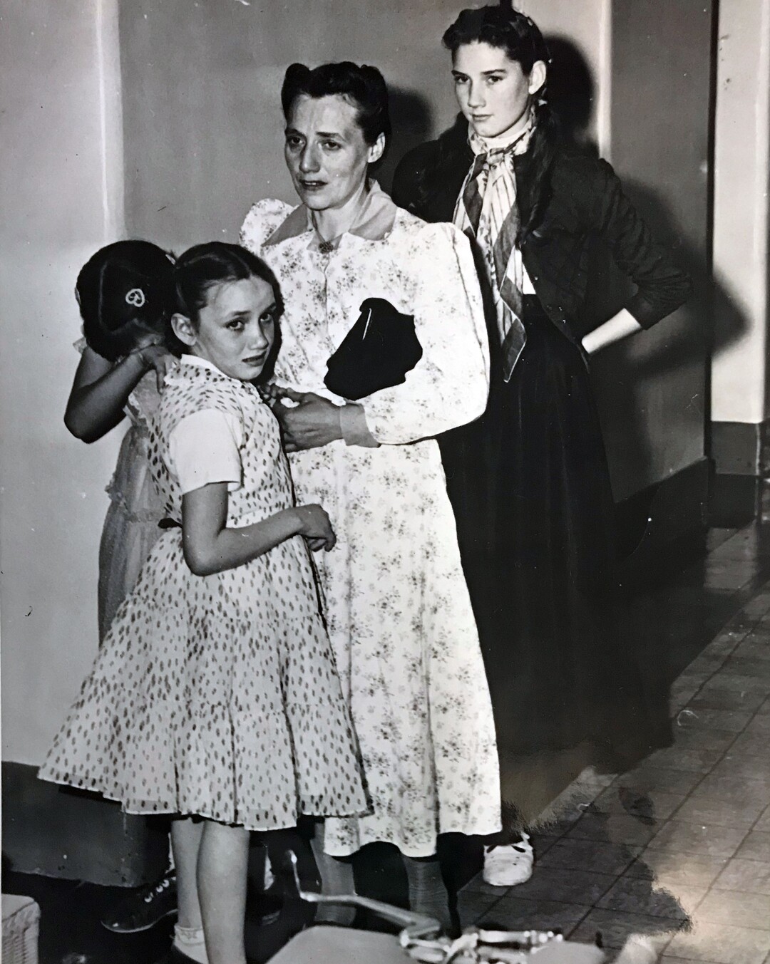 (Tribune file photo)  Vera Johnson Black comforts Elsie, 11, as Emily 9, holds her sister's arm. At the rear is Lillian, 14. Seven of Black's children were placed in state custody after the 1953 raid on Short Creek, which lead to a Utah Supreme Court case.