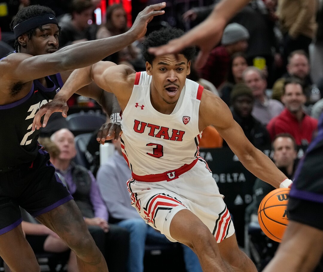(Leah Hogsten | The Salt Lake Tribune) Utah Utes forward Bostyn Holt (3) drives to the net as the University of Utah hosts the TCU Horned Frogs at Vivint Arena, Dec. 21, 2022. 
